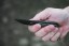 TOPS ALRT XL-03 compact fixed blade knife featuring a black utility blade with a durable angular tip and black canvas micarta handles.