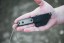 TOPS ALRT XL-03 compact fixed blade knife featuring a black utility blade with a durable angular tip and black canvas micarta handles.